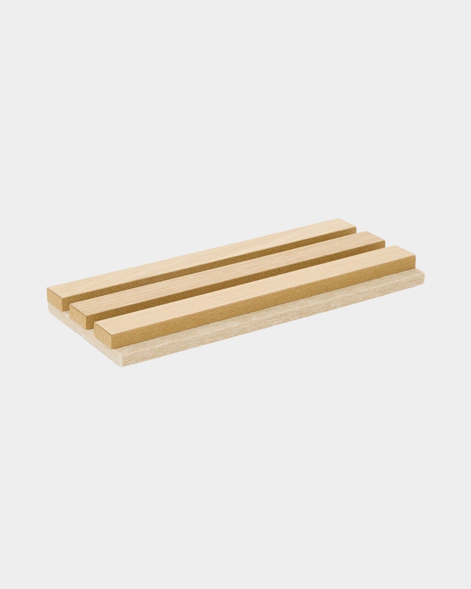 WoodUpp Tonal sample in Classic Oak with beige felt backing, a rectangular acoustic panel featuring three raised wood strips for home organization or display.